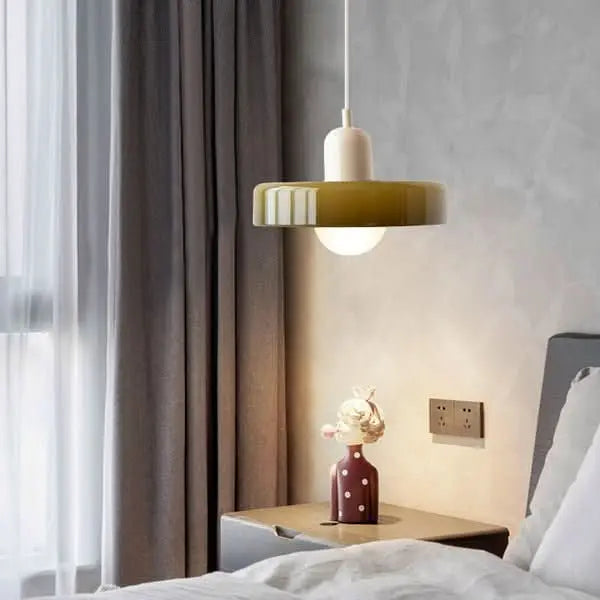 Contemporary colored glass pendant, sleek Bauhaus design for minimalist lighting.
