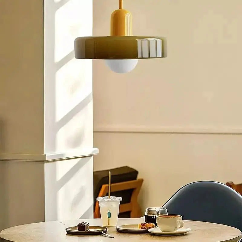 Decorative round glass pendant, a modern Bauhaus fixture for ambient lighting.