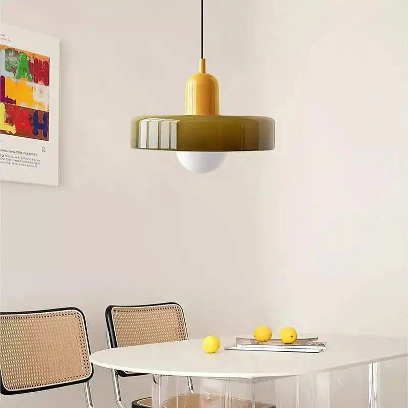 Elegant adjustable pendant light with colored glass, perfect for unique home decor.