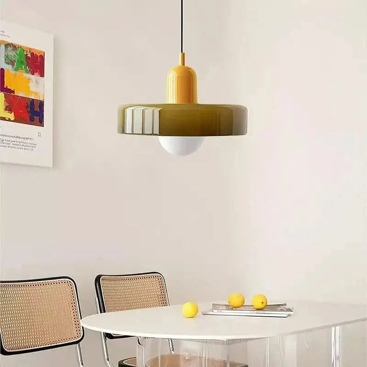 Elegant adjustable pendant light with colored glass, perfect for unique home decor.