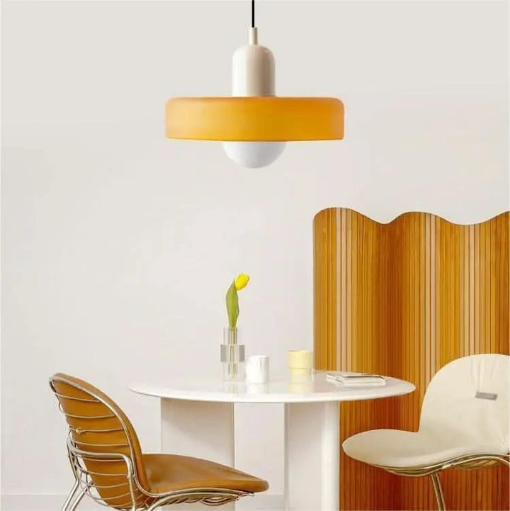 Unique modern ceiling light, vibrant colored glass shade, ideal for statement decor.