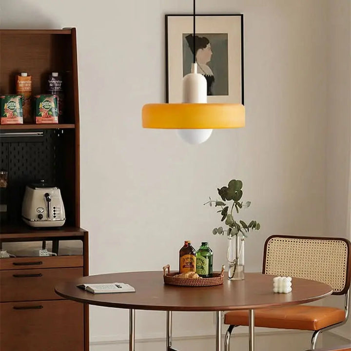 Elegant modern pendant light, colored glass, perfect for creating a chic atmosphere.
