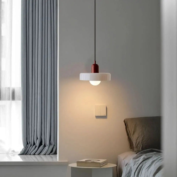 Decorative Bauhaus pendant light, round colored glass, adding artistic touch to decor.