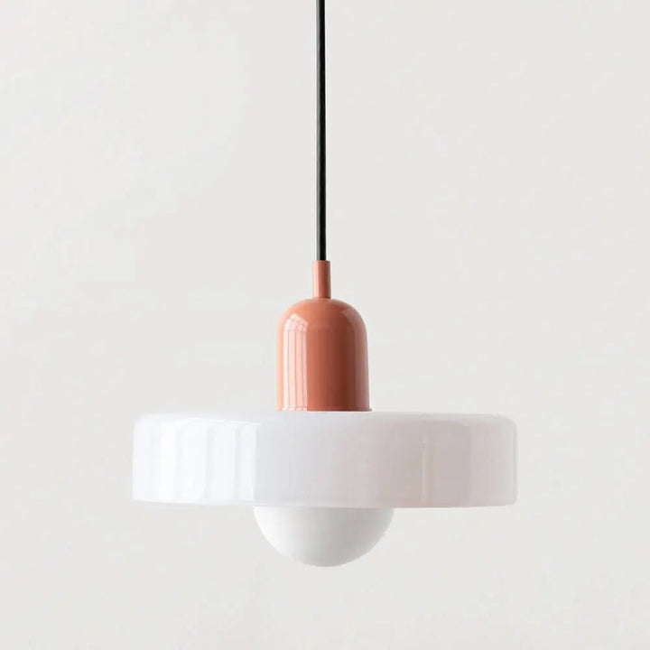 Elegant colored glass pendant light, a round modern fixture for sophisticated homes.
