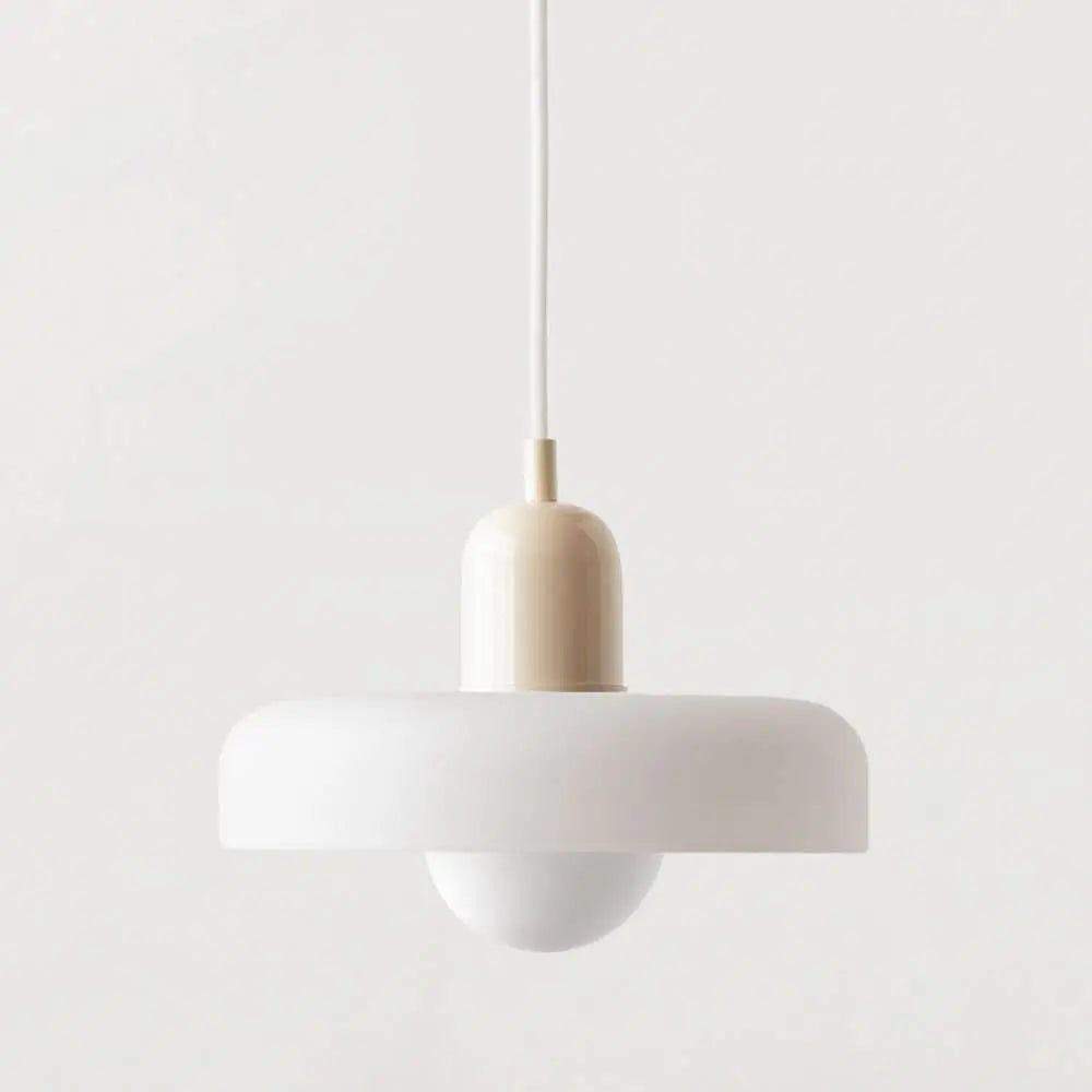 Elegant contemporary pendant, vibrant colored glass, perfect for a chic dining area.