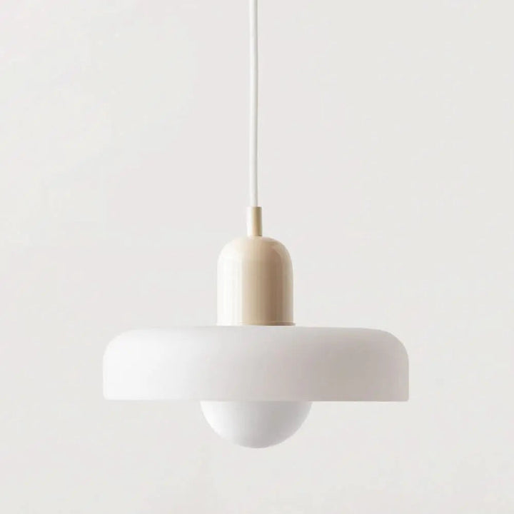 Elegant contemporary pendant, vibrant colored glass, perfect for a chic dining area.
