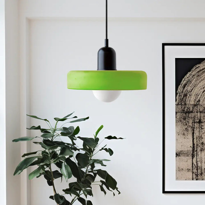 Unique colored glass pendant light, contemporary design, perfect for a modern bedroom.