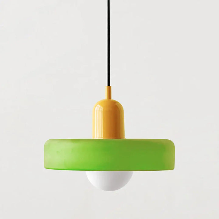 Sleek modern glass pendant, colored and round, perfect for a bright, modern kitchen.