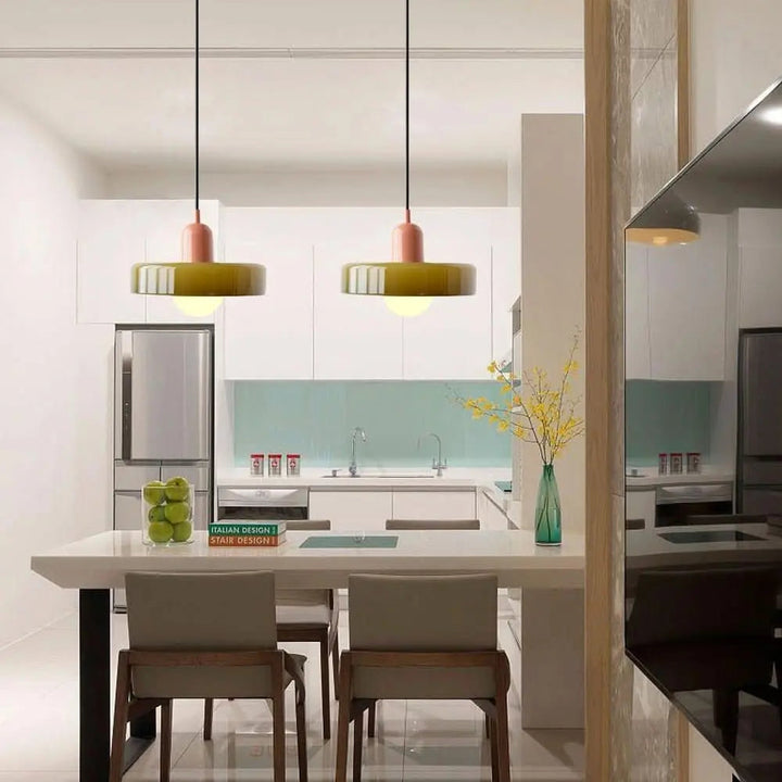 Sleek modern pendant light with translucent colored glass, ideal for a dining room.