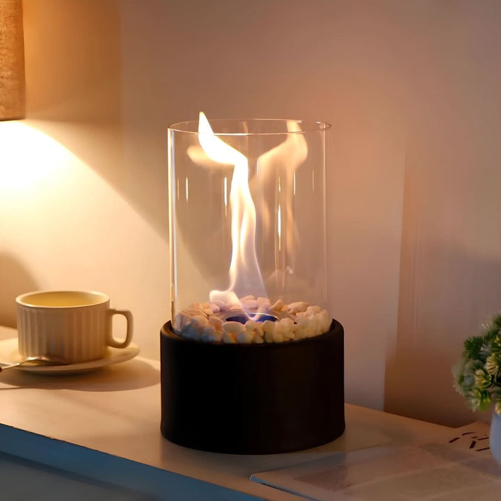 Decorative bioethanol table fire with contemporary glass shield. Clean burning flame for any space.