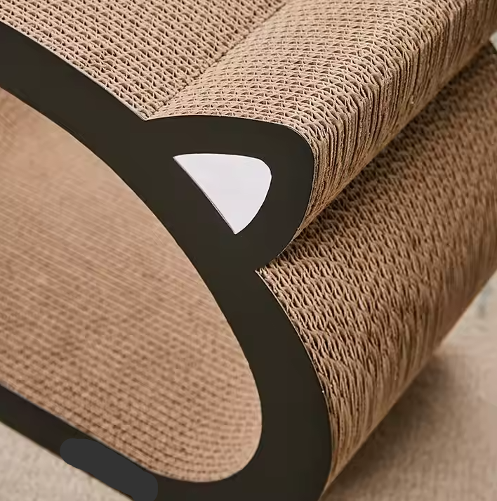 Close-up of the corrugated cardboard texture on a modern cat scratching furniture and lounger bed.