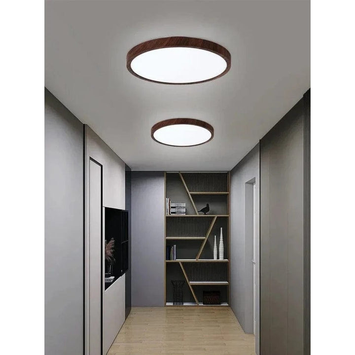 Contemporary circular wooden LED overhead lamp. Energy-saving, flush mount for a clean look.