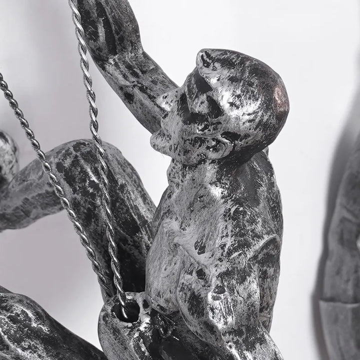 Artistic wall-mounted climbing figures for a modern decorative touch.