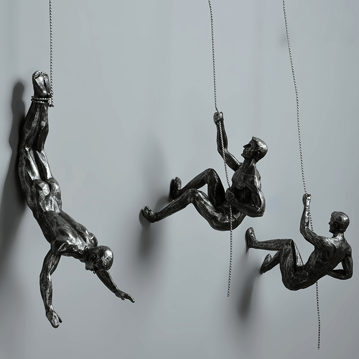 Modern home accent: Climbing figures wall sculpture set for stylish decor.