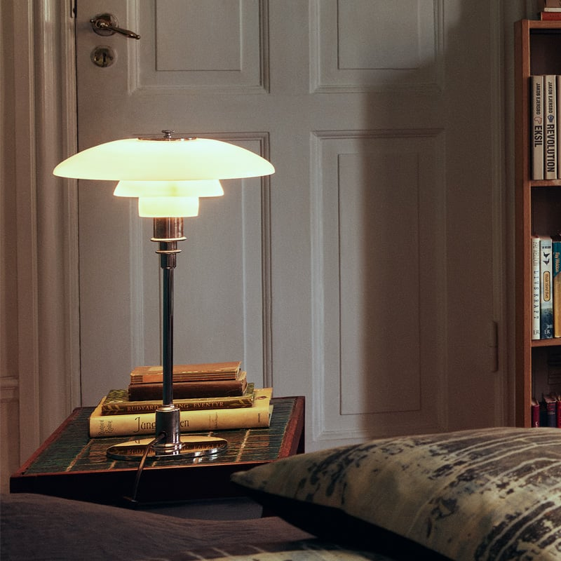 Designer LED table lamp, warm glow, contemporary Scandinavian lighting fixture for modern interiors.
