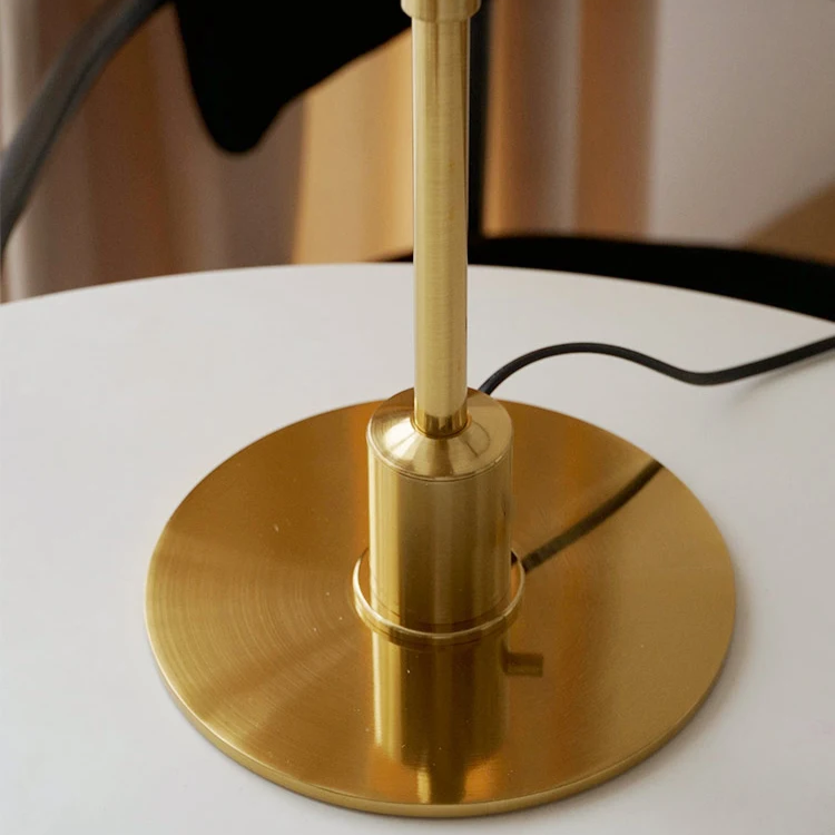Elegant LED lamp, modern Danish aesthetic, provides warm ambient light for any room.