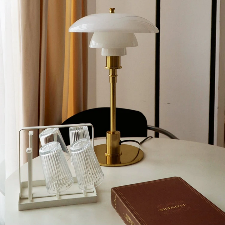 Sleek modern LED table lamp, Danish design, soft warm ambient glow for cozy home lighting.