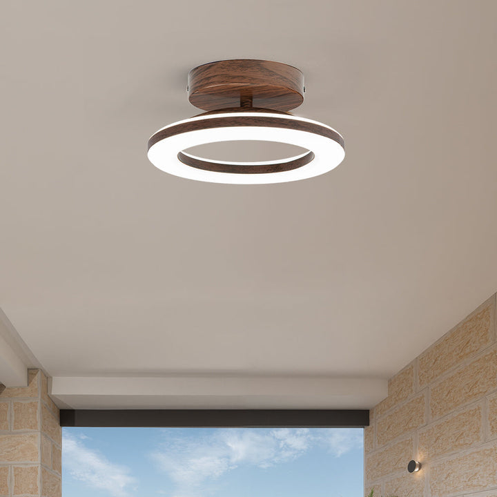 Round LED ceiling light, a modern disc fixture providing energy-efficient, chic home illumination.
