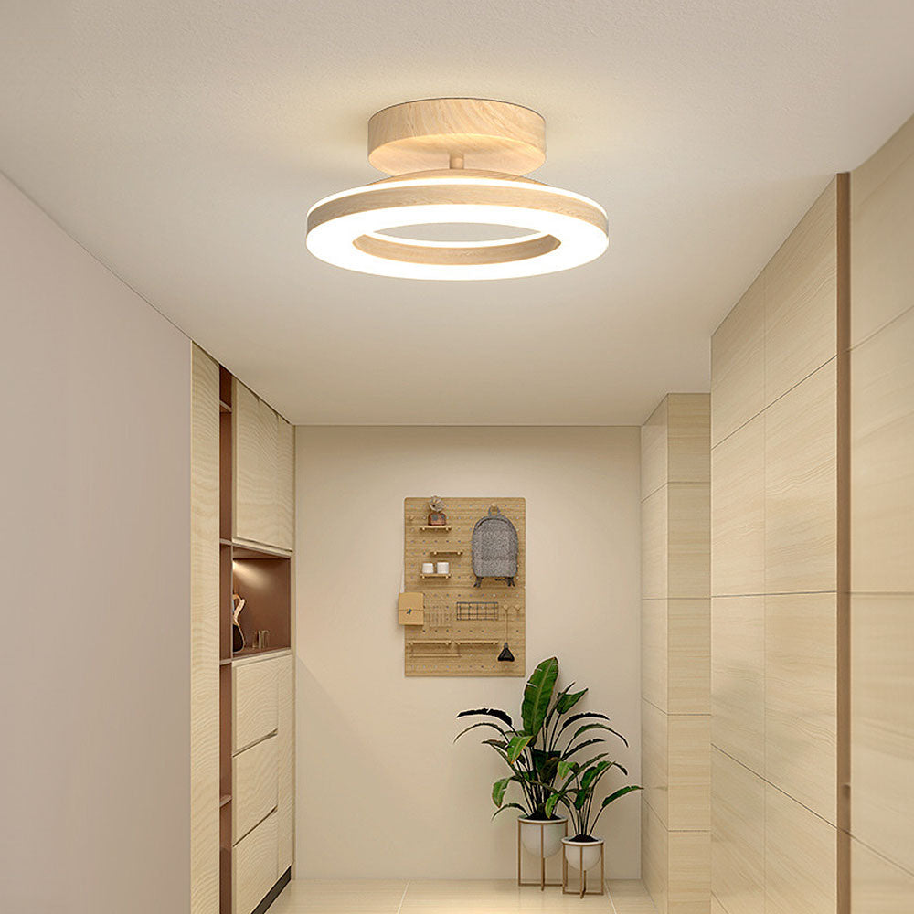 Sleek LED disc ceiling light for modern hallways & bedrooms, offering neutral ambient glow.