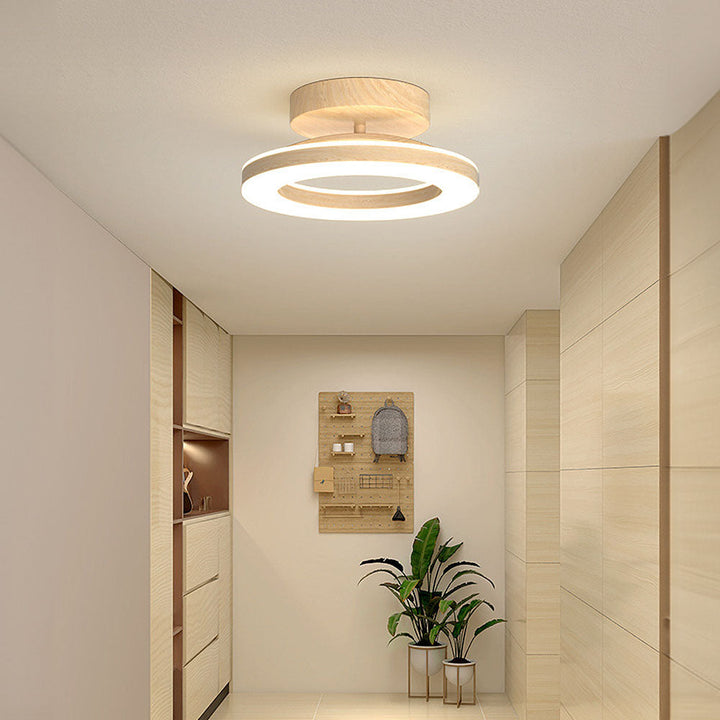 Sleek LED disc ceiling light for modern hallways & bedrooms, offering neutral ambient glow.