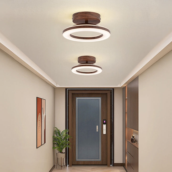 Chic modern disc LED ceiling lamp, a round fixture bringing contemporary style and neutral light.