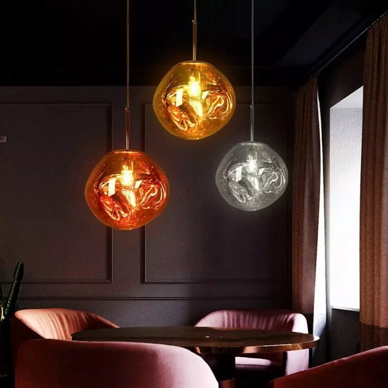 Modern Melt pendant light, luxurious gold finish, stylish living room decor accent.