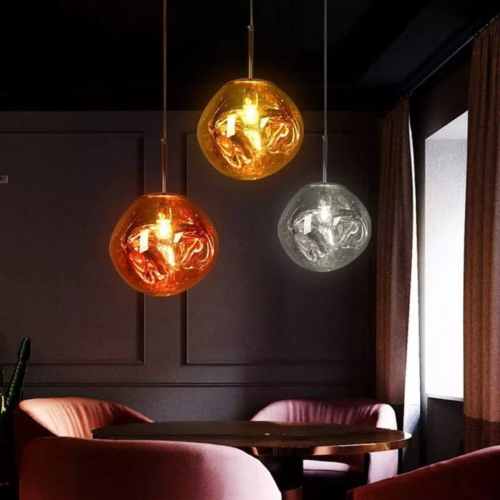 Modern Melt pendant light, luxurious gold finish, stylish living room decor accent.