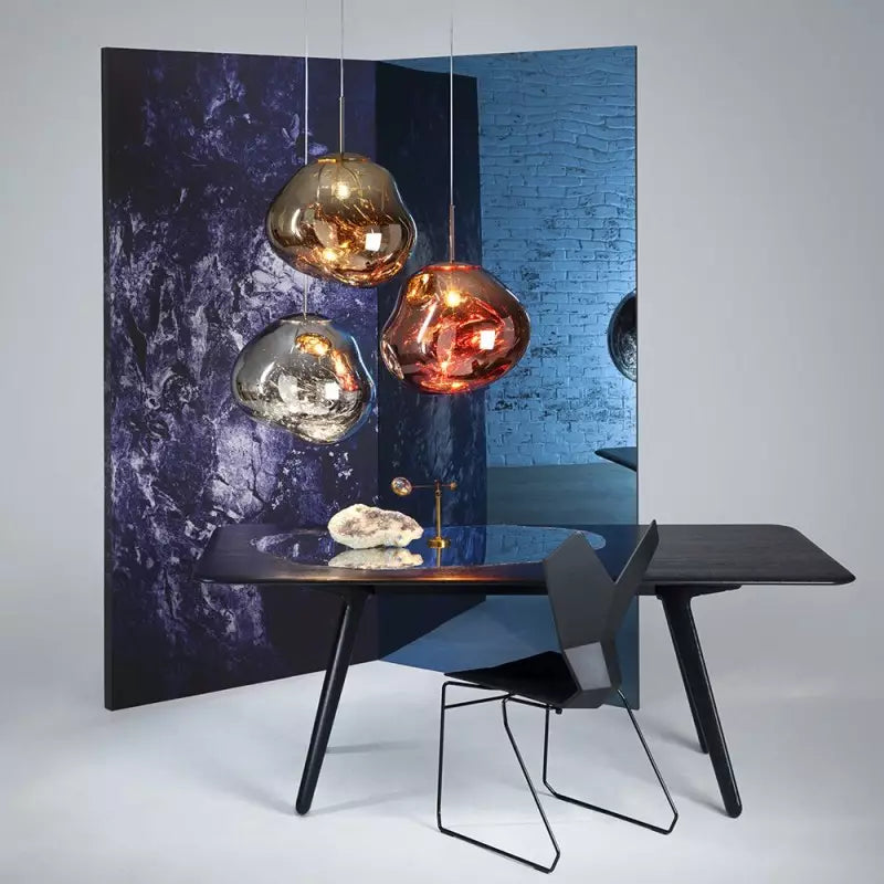 Vibrant red Melt pendant lamp, artistic lighting for a contemporary dining space.