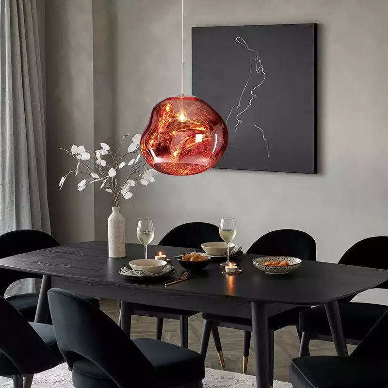 Sleek silver Melt pendant lamp, contemporary statement lighting for home decor.