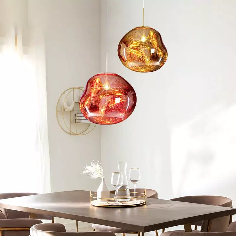 Atmospheric gold Melt pendant lamp, unique design for living room or dining area.