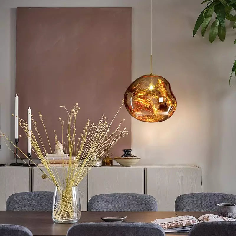 Artistic red Melt ceiling light, modern statement piece, adds warmth to interiors.