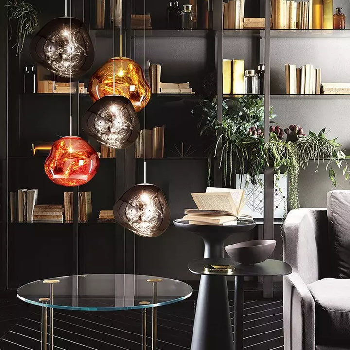 Contemporary silver Melt pendant lamp, ideal for modern dining room lighting.