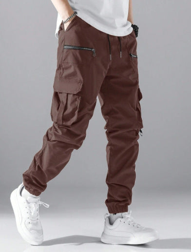 Close-up of tactical cargo pants, highlighting secure zippered utility pockets & durable fabric.