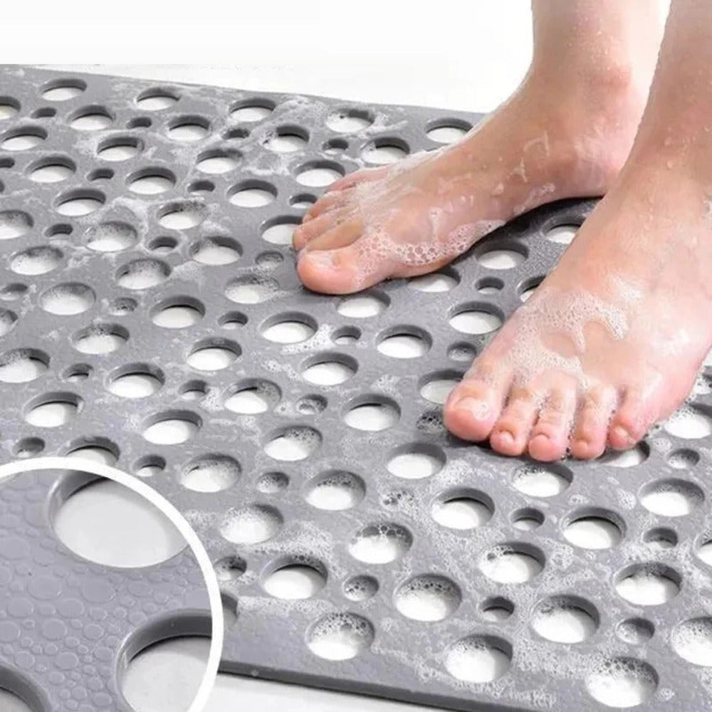 Textured non-slip shower mat ensuring bathroom safety, comfort, and hygiene for all ages.