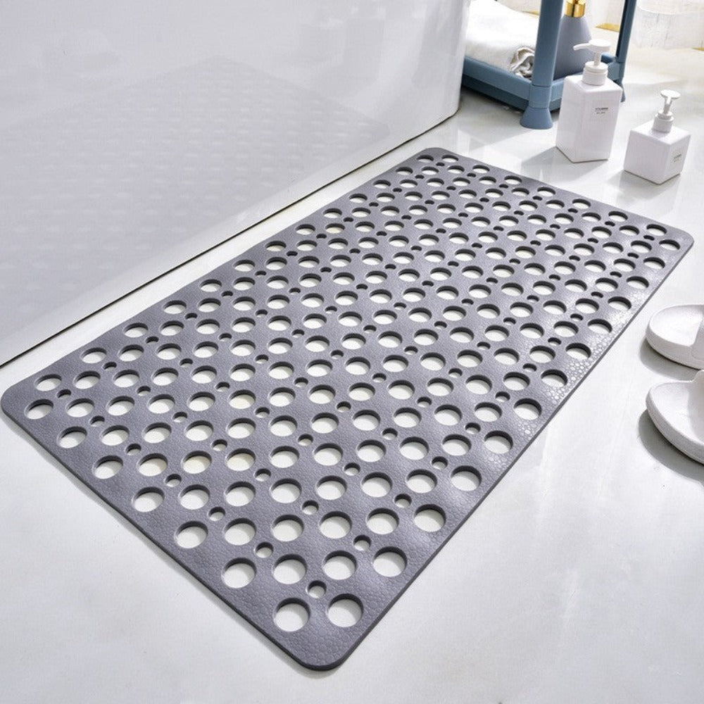 Durable non-slip shower mat with drainage holes, promoting hygiene and preventing slips.