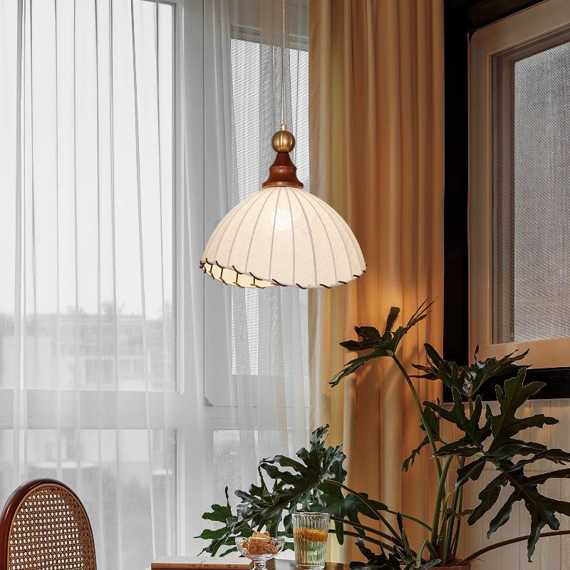 Stylish ceiling lamp with modern pleated fabric shade and gold finish.