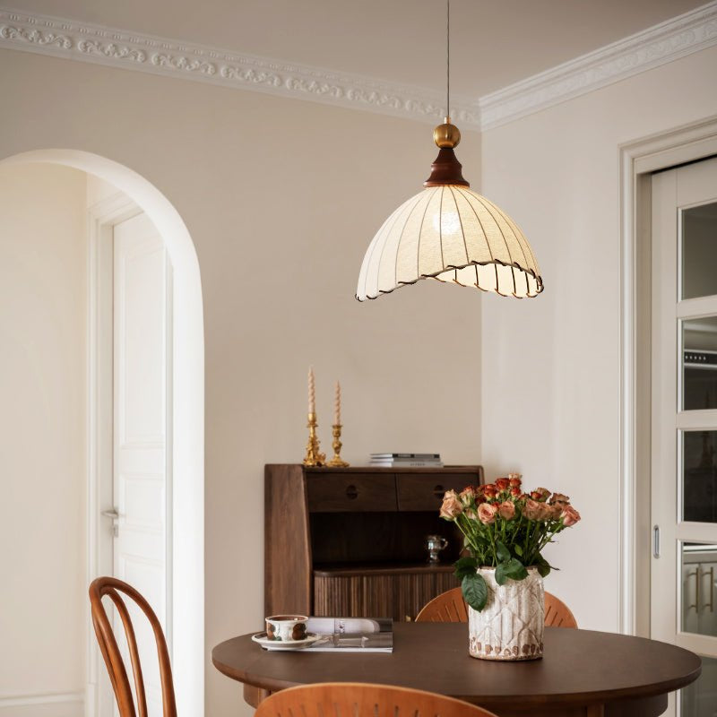 Fabric pendant light, modern aesthetic, unique pleated design & wood accent.