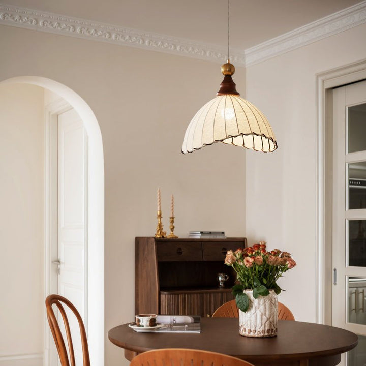 Fabric pendant light, modern aesthetic, unique pleated design & wood accent.
