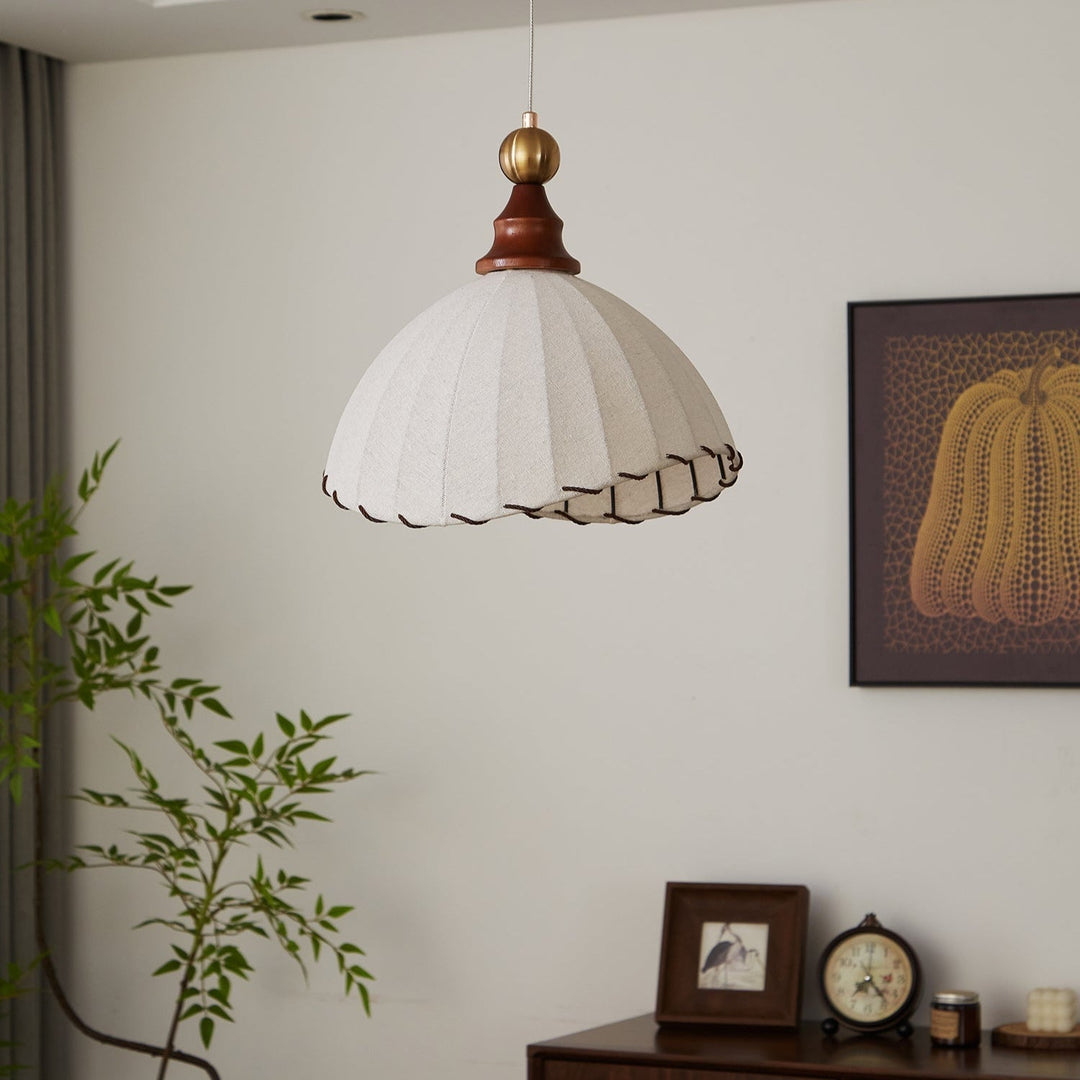 Elegant modern fabric pendant light, gold finish, perfect for contemporary living spaces.