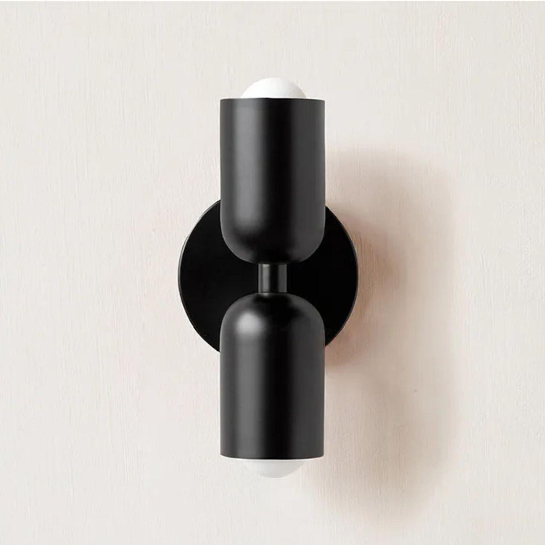 Artistic double wall lamp, modern Scandinavian, creating a warm ambient glow in any room.
