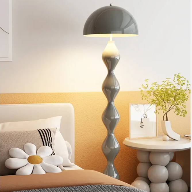 "Modern Scandinavian floor lamp with sleek metal frame and glowing shade in minimalist design for contemporary home decor."