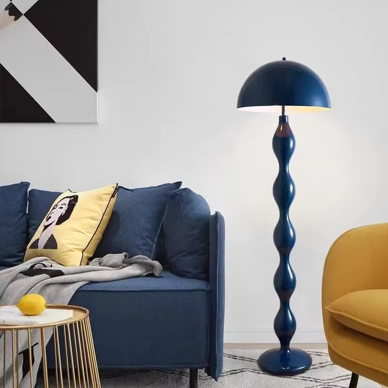 "Modern Scandinavian floor lamp with sleek metal frame and glowing shade in minimalist design for contemporary home decor."