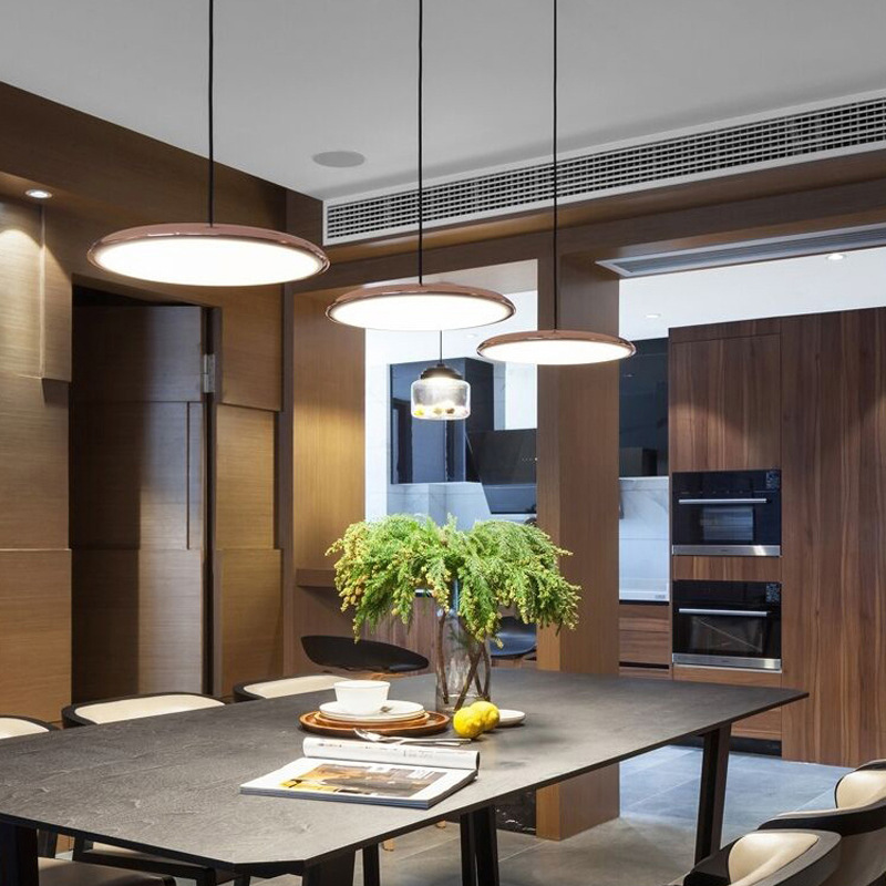 Modern white LED pendant lamp, sleek design for stylish dining room or living area.