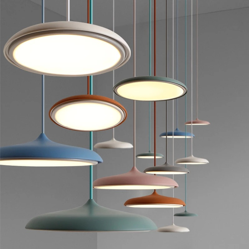 Geometric LED pendant light, sleek modern design in white or black metal.