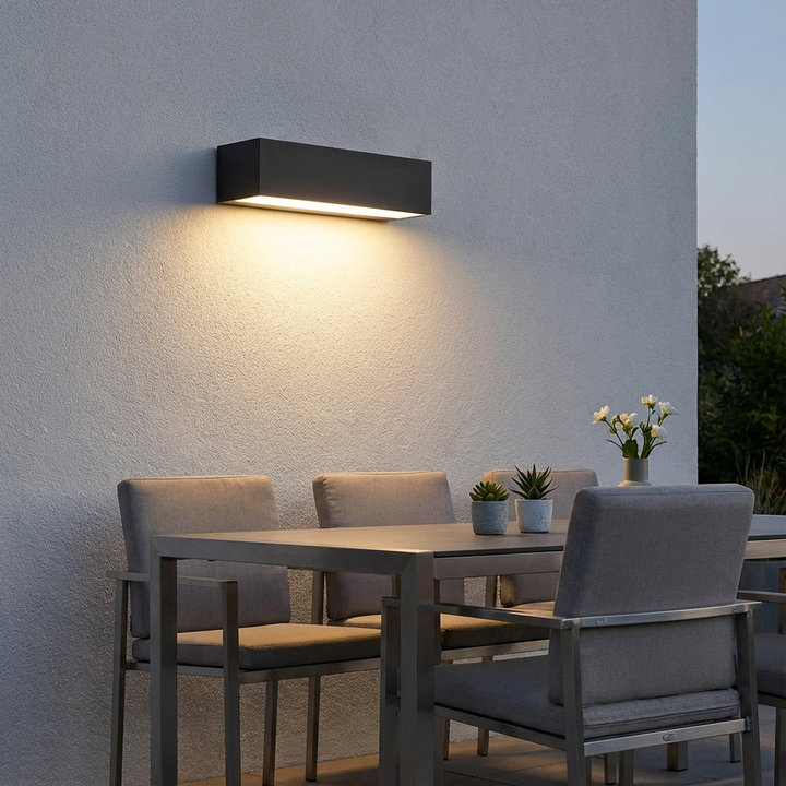 Modern solar outdoor LED wall lamp illuminating pathways, gardens & facades. IP65 waterproof.
