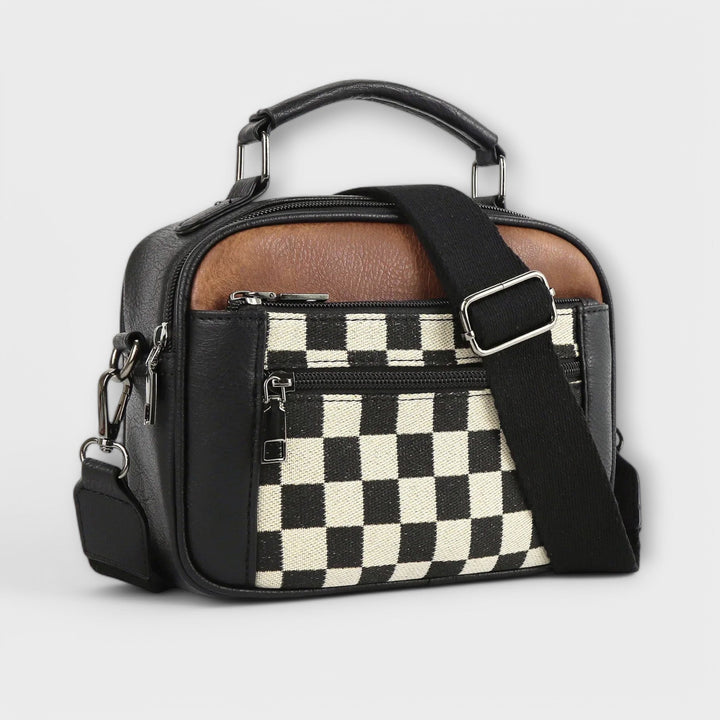 Modern structured black crossbody shoulder bag for women, perfect for everyday use or travel.