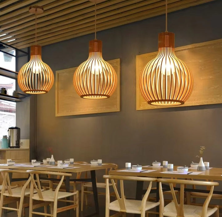 Cozy Natura Orb organic wooden pendant lamp, providing warm natural light for modern interior decor.