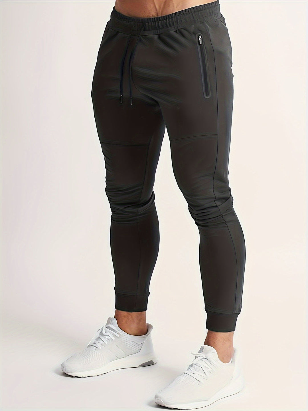 Navy blue men's slim fit performance joggers for athletic wear. New polyester comfort pants.