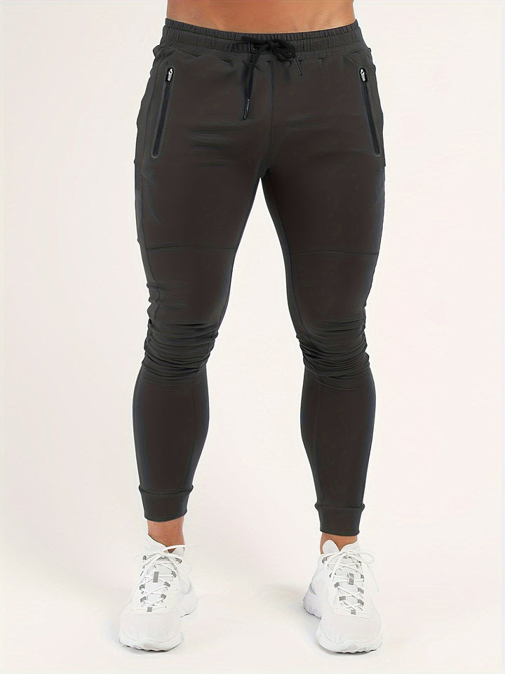 Black men's slim fit joggers, ideal for casual wear and active lifestyles. New athletic pants.