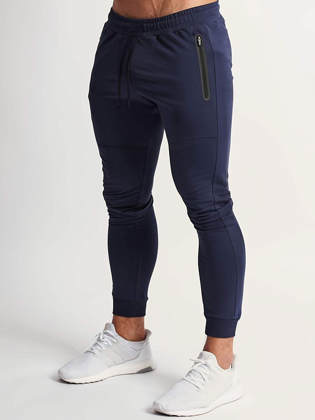 Men's slim fit joggers in navy, designed for performance and casual comfort. New athletic pants.